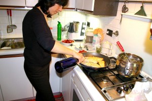 Anna Maria cooks rombo in her Venice kitchen.