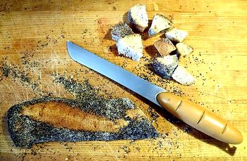 preparing poopyseed baguette for bread pudding