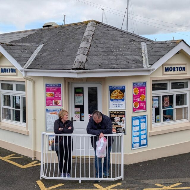 Some people claim that Morton's of #Ballycastle has the best fish and chips in the U.K.  They have been serving it for over a century. This fried hake and chips were definitely crisp and tasty. @mortonsballycastle  @discoverni
