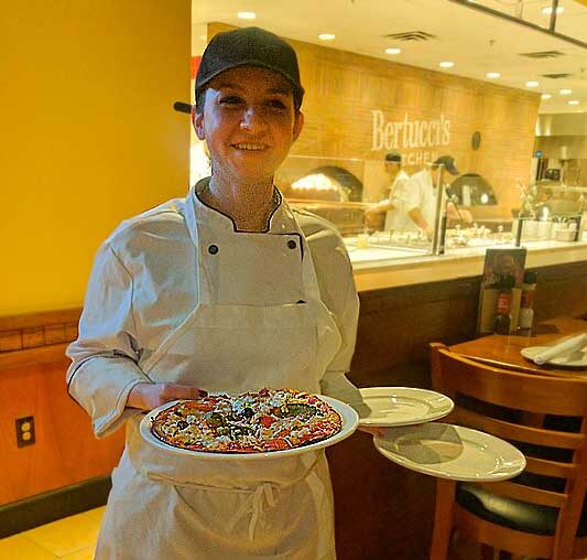 Melissa Surber delivers chicken marengo pizza at Bertucci's in Medford