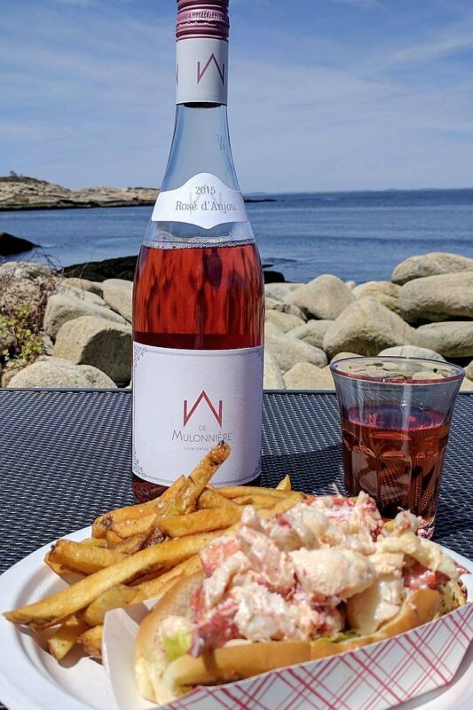 Rosé d'Anjou with lobster roll at Lobster Pool on Folly Cove in Rockport, Mass.