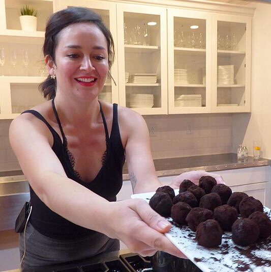 Erika Chavez-Graziano offers bourbon balls at Mesa in New Albany