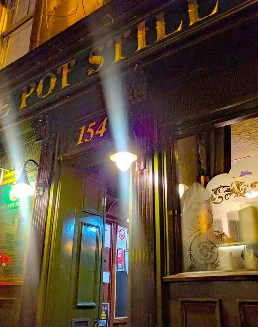 Raise high the glass at The Pot Still in Glasgow
