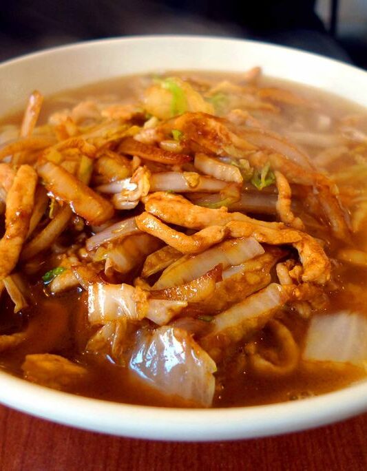 The noodles are made from scratch for this hearty pork and vegetable soup served at Restaurant Noodle Factory.