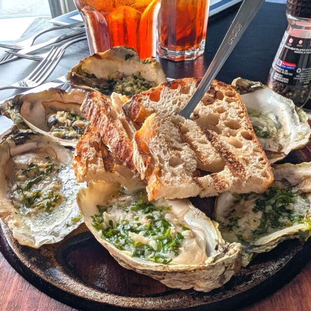 The Tennessee Aquarium launched Chattanooga's effort to reclaim its riverfront. The Riverwalk features natural beauty and some good eating, like these oyster and grilled tuna salad at Boathouse Rotisserie and Bar. @visitchatt @boathouse_cha https://hungrytravelers.com/chattanooga-embraces-its-river-city-identity/